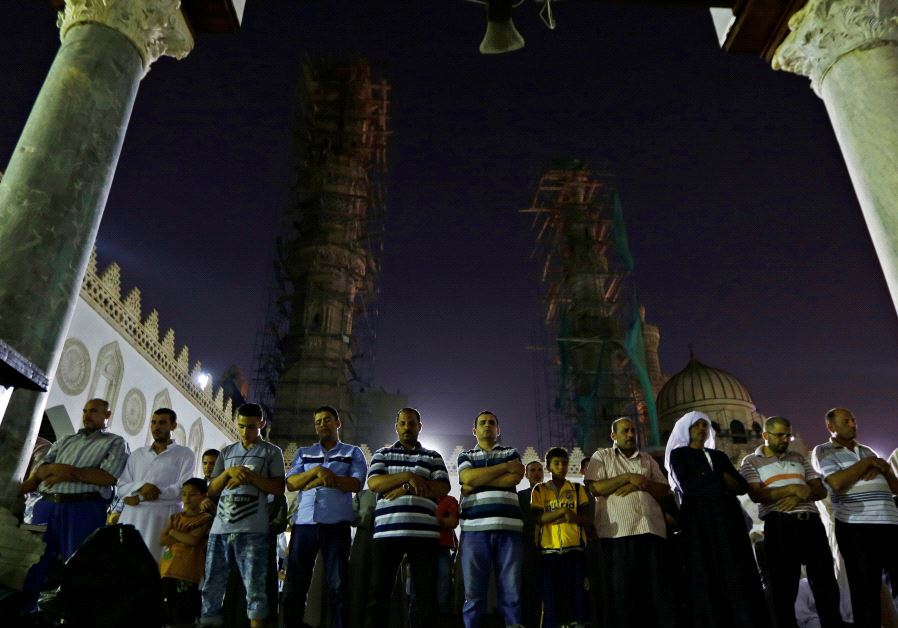 Egyptian Muslims take part in evening prayers called "Tarawih" on Laylat al-Qadr or Night of Decree, at Al-Azhar Mosque in old Cairo, Egypt June 21, 2017.