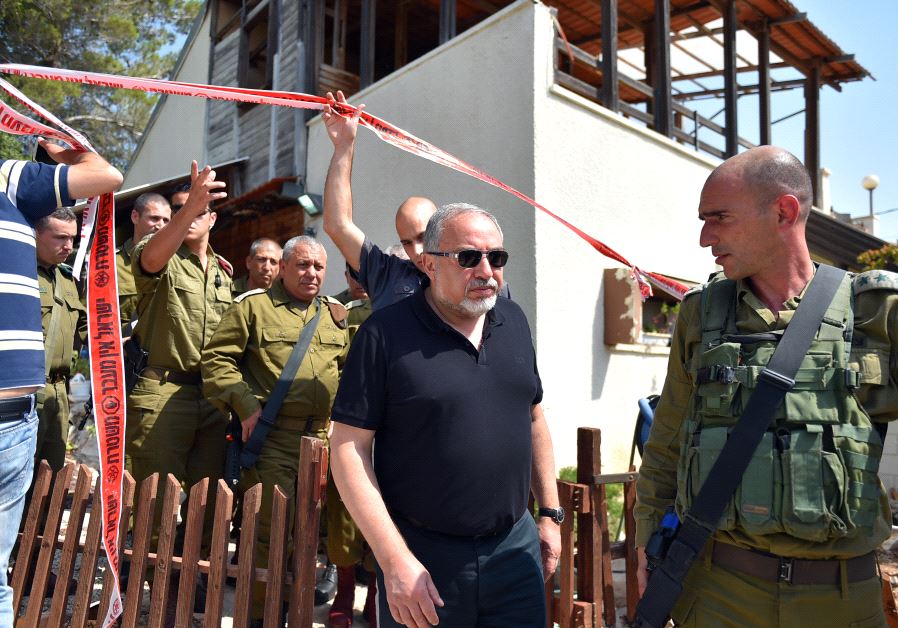 Defense Minister Avigdor Liberman and IDF Chief of Staff Gadi Eisenkot leave the scene of the deadly attack in Halamish, July 22, 2017.