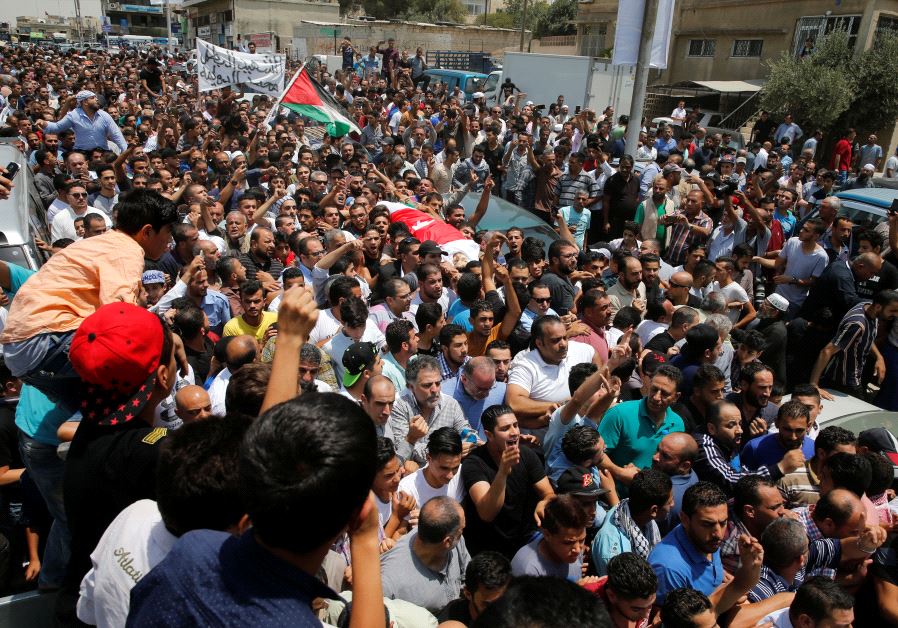 People attend the funeral of Mohammad Jawawdah in Amman, Jordan July 25, 2017. 